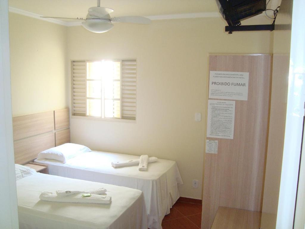 Hotel Perez Pouso Alegre Szoba fotó